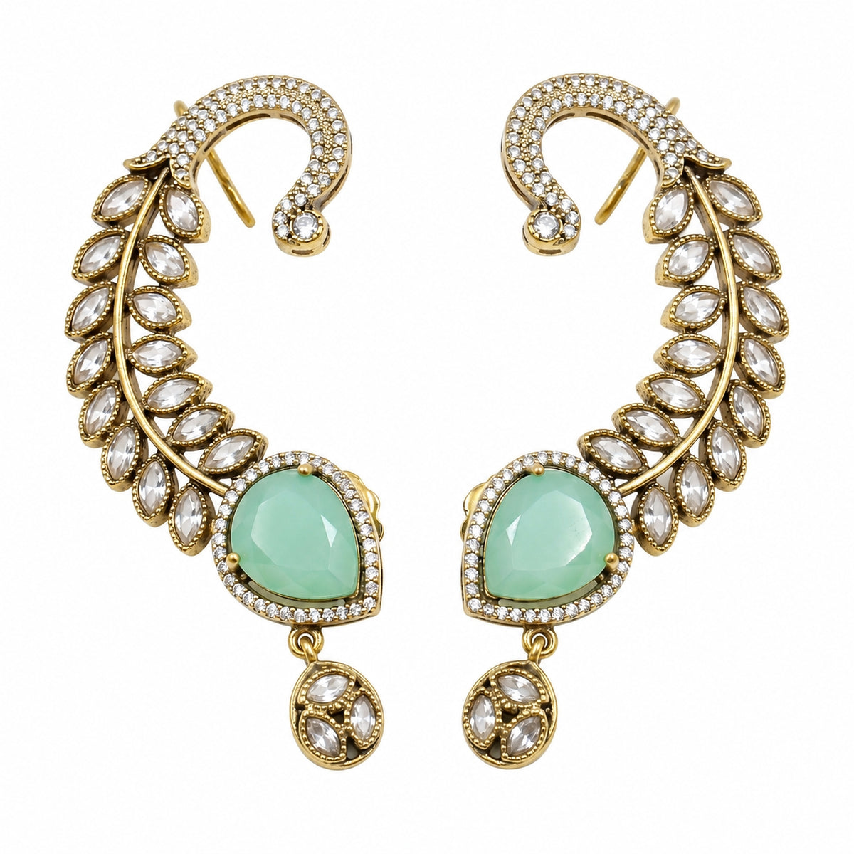 A pair of gold crescent-shaped drop earrings decorated with clear marquise and round crystals, featuring a large light green teardrop-shaped center stone on each earring.