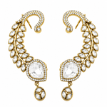 A pair of gold crescent-shaped drop earrings adorned with clear marquise and round gemstones, set against a plain white background.
