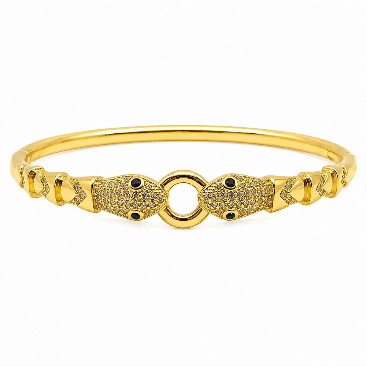 A gold-plated bangle bracelet featuring two fish-shaped charms paved with small clear stones and accented with tiny black gemstones, set against a plain white background.