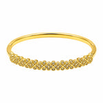 A gold bangle bracelet featuring a row of small pavé-set clear stones across the front, displayed on a clean white background.