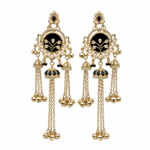 A pair of ornate gold-toned dangle earrings with black enamel inlays, white faux pearl borders, and hanging chain tassels on a plain white background.