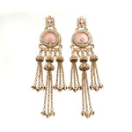 A pair of ornate gold-toned dangle earrings with pale pink oval stones, floral tops, and multiple dangling chain and bell charms, shown on a plain white background.