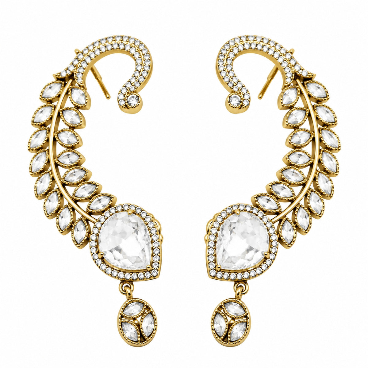 A pair of gold crescent-shaped drop earrings adorned with clear marquise and oval gemstones, set against a plain white background.