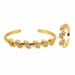 Gold-toned cuff bracelet with multiple rows of pavé-set clear stones, shown in both a straight open cuff view and a closer detail view on a plain white background.