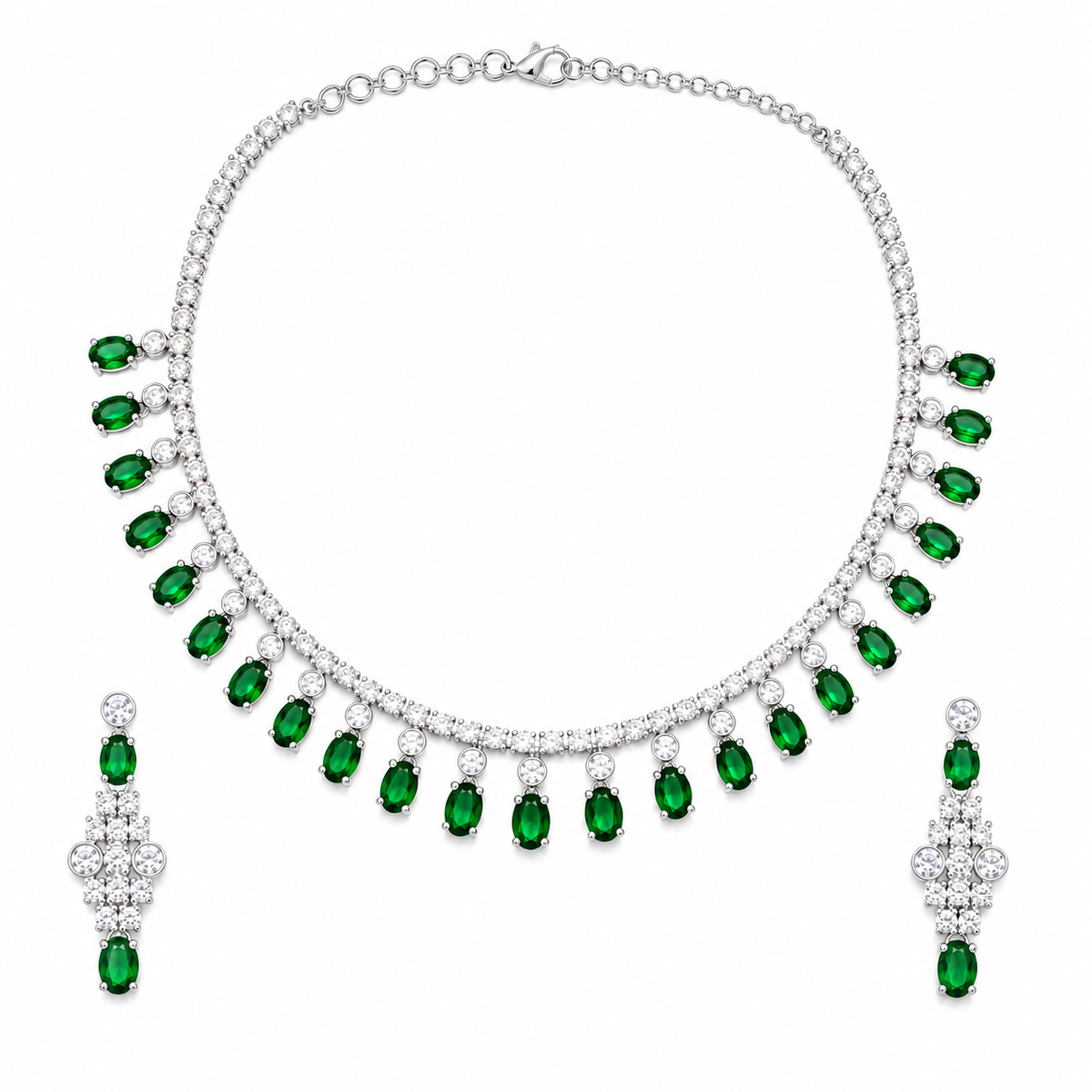 A silver-tone jewelry set featuring a necklace and matching drop earrings, both adorned with rows of clear stones and a series of oval-cut green emerald-shaped gems hanging along the front.